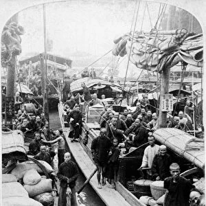 CHINA: CANTON, c1900. Chinese passengers on river boats in Canton, China. Stereograph