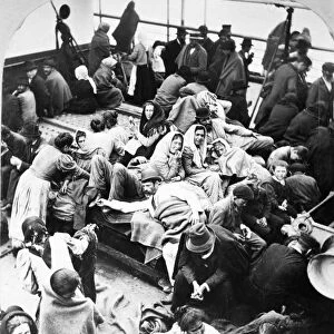 EUROPEAN IMMIGRANTS, 1902. European immigrants on the deck of a ship arriving at New York Harbor