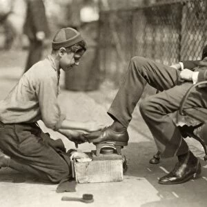 HINE: BOOTBLACK, 1924. A 12-year-old bootblack shining shoes in Bowling Green, New York City
