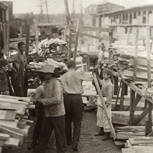 HINE: CHILD LABOR, 1910. Young boys working for Hickok Lumber Co. in Burlington, Vermont