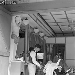 KEY WEST: BARBER, 1938. Barber shop in Key West, Florida. Photograph by Arthur Rothstein