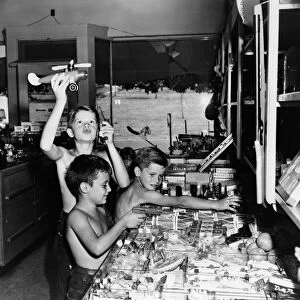 MARYLAND: BOYS PLAYING. Boys playing with toys in a store, Greenbelt, Maryland