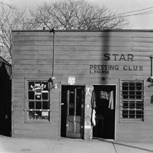 MISSISSIPPI: STOREFRONT, 1936. An African American tailor and barbershop in Vicksburg