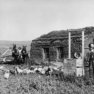 NEBRASKA: SETTLERS, 1888. Homesteader James McCrea and family in front of their