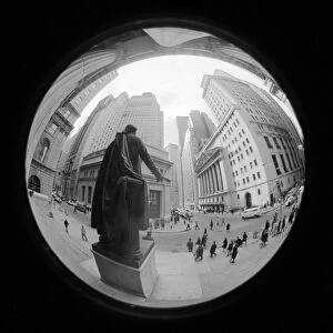 NEW YORK CITY, 1971. Fish-eye view of Wall Street from the steps of Federal Hall in New York City