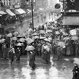 NEW YORK: MAY DAY, 1909. A crowd gathered in the rain for a May Day parade in New York City