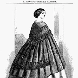 WOMENs FASHION, 1857. Ladies cloak. Fashion illustration from an American Magazine of 1857
