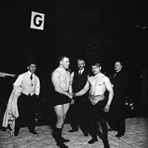 WRESTLING MATCH, 1908. At a match in 1908, American wrestler Jim Bagley, right