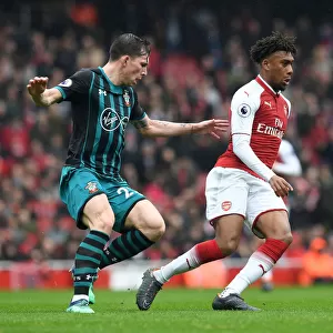 Arsenal's Alex Iwobi Clashes with Southampton's Pierre-Emile Hojbjerg in Intense Premier League Showdown