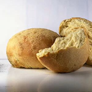 Whole and broken loaves of Pane, Semolina bread