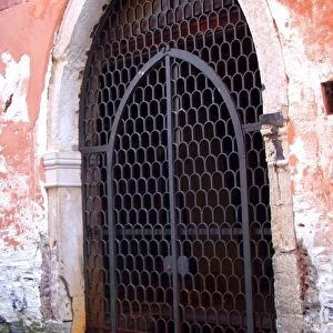 Gate entrance to canal side building, Venice, Italy