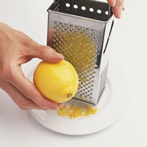 Grating Lemon onto Plate