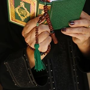 Muslim woman reading the Kuran
