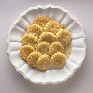 Plate of Gnocchi alla Romana, semolina dumplings served with butter, a traditional dish from Rome, Italy, view from above