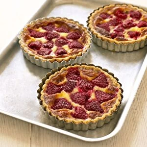 Three raspberry tarts