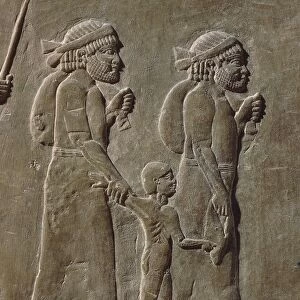 Relief depicting peasants and child, from Palace of Ashurbanipal at Nineveh, Iraq