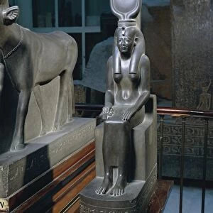 Schist statue of seated Isis with solar disk crown, from Saqqara