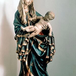 Schone Madonna Virgin Mary holding the baby Jesus. Painted statue, Pfarrkirche, Bad Aussee, Austria