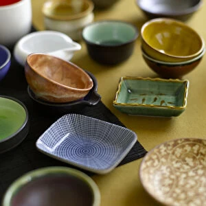 Selection of food dishes including rice bowls and plates