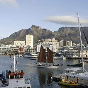 South Africa, Cape Town, Victoria and Alfred Waterfront, view of main basin with sailing ship, and Table Mountain in the background