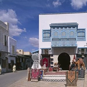 Tunisia, Kairouan, Old Town, Bourguiba Avenue, typical blue balcony and carpet sellers