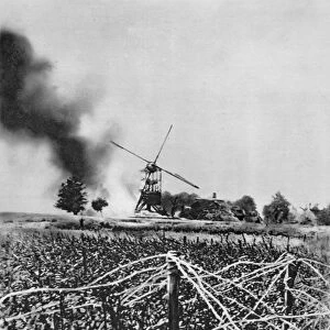 World War I 1914-1918: Windmill destroyed by German shellfire. Barbed wire defences in foreground