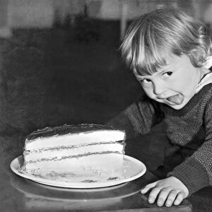 A Young Boy Ready For Cake