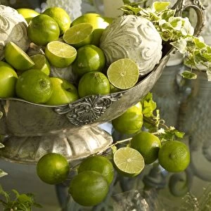 Antique silver bowl with limes