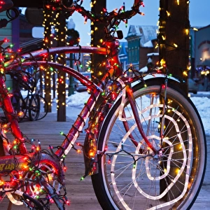Bicycle covered in colored lights