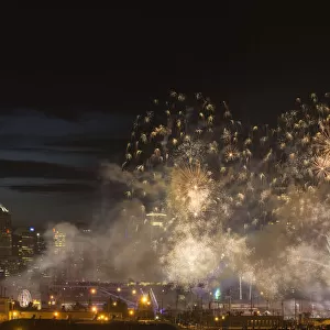 Fireworks in front of modern city skyline