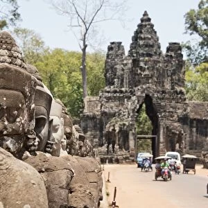 Gate entrance to Angkor Thom with guarding statues