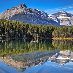 Rocky Mountains Reflected In Herbert Lake, Banff National Park, Alberta, Canada