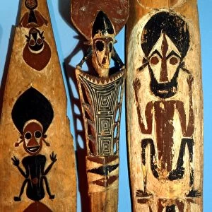 POLYNESIAN MYTHOLOGY Wooden paddles, painted with traditional figures. From the