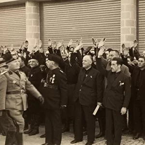 The construction workers of the Company Mauro Toschi fu Ulisse, salute the Duce Benito Mussolini during Inauguration of the buildings of the Royal Airport "Fausto Fish"in Bologna, 24 / 10 / 1936 (b / w photo)