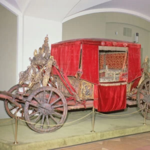 English carriage, carved wood, painted and gilt decoration with velvet curtains (photo)