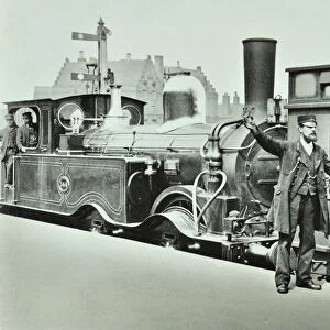 Platform Porter at a railway station, 1885 (b / w photo)