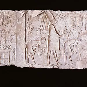 Relief of the heretic King Akhenaten depicting the king standing, arms upraised