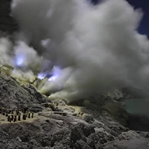 Burning sulphur in mining area on Kawah Ijen Volcano, Java, Indonesia