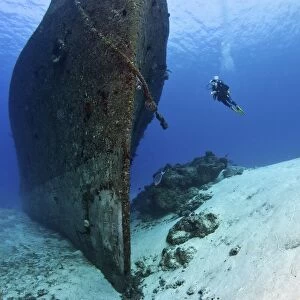 Diver exploring the Felipe Xicotencatl shipwreck in Cozumel, Mexico