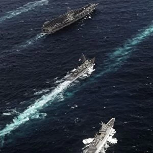 The John C. Stennis Carrier Strike Group are underway in formation with naval vessels