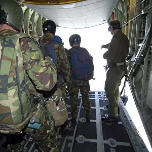 Members of the Pathfinder Platoon wait for parachute jump training aboard a C-130
