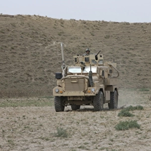 A U. S. Army Cougar patrols a wadi in Kunduz Afghanistan