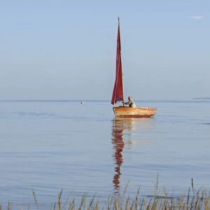 Small traditional sailing boat on the Thames Estuary, Two Tree Island, Essex, England