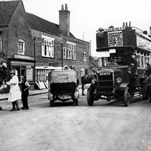 1920s Thornycroft J bus in busy street scene. Creator: Unknown