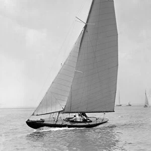 The 6 Metre Jean (K16) sailing upwind, 1922. Creator: Kirk & Sons of Cowes