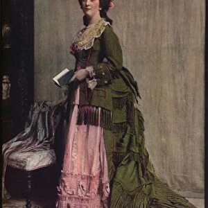 An afternoon dress of green and pink silk. Very typical of the modes between 1868 and 1878, c1913
