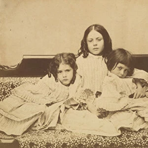 Edith, Ina and Alice Liddell on a Sofa, Summer 1858. Creator: Lewis Carroll