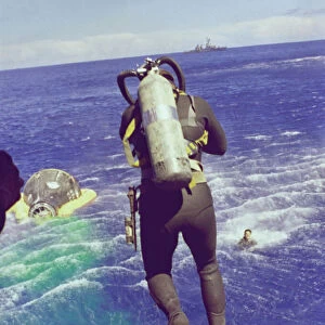 Navy diver leaps from helicopter, 1965. Creator: NASA