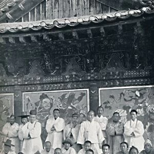 Priests and monks in a Korean monastery, or lamasery, 1902. Artist: Walter Hillier