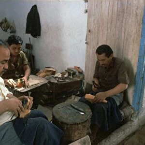 Shoemakers in a Tunisian souk